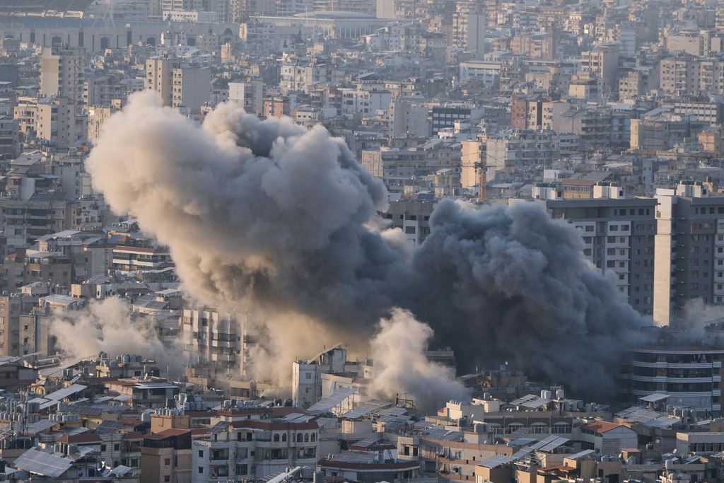 Smoke rises from an Israeli airstrike in Dahiyeh, Beirut's southern suburbs, Lebanon, Tuesday, March 10, 2026. (AP Photo/Bilal Hussein)