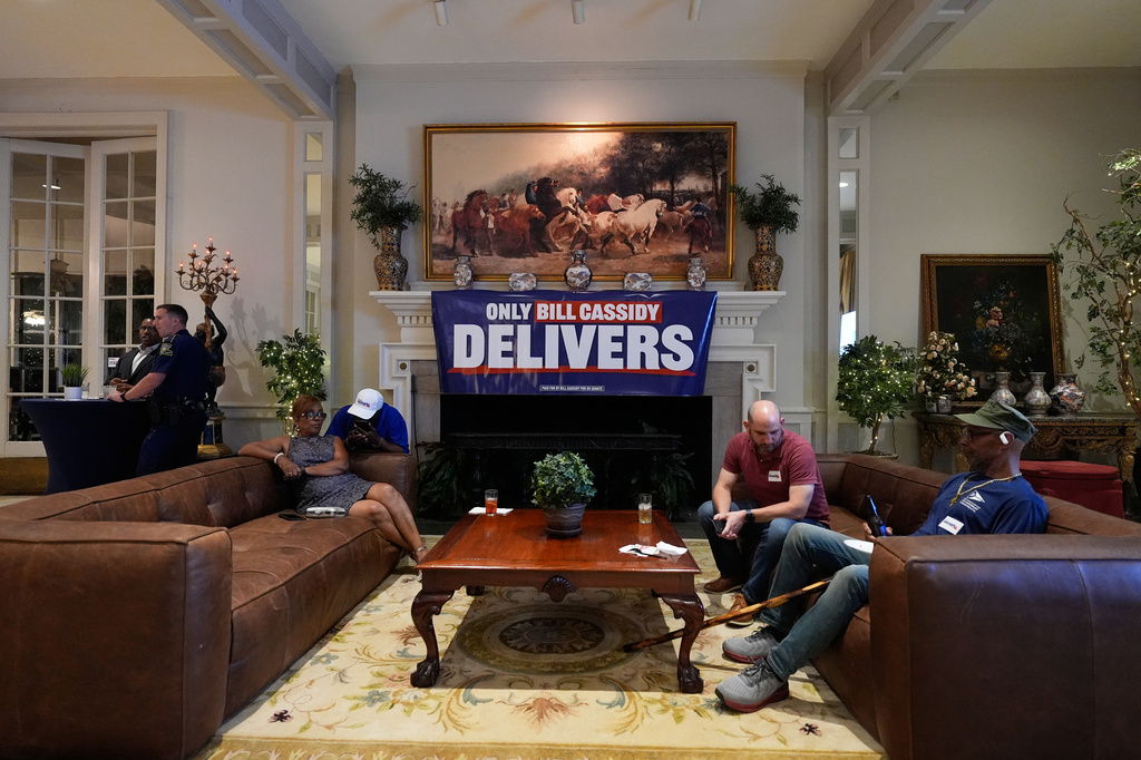Attendees sit during an election night watch party for Sen. Bill Cassidy, R-La., Saturday, May 16, 2026, in Baton Rouge, La. (AP Photo/Gerald Herbert)