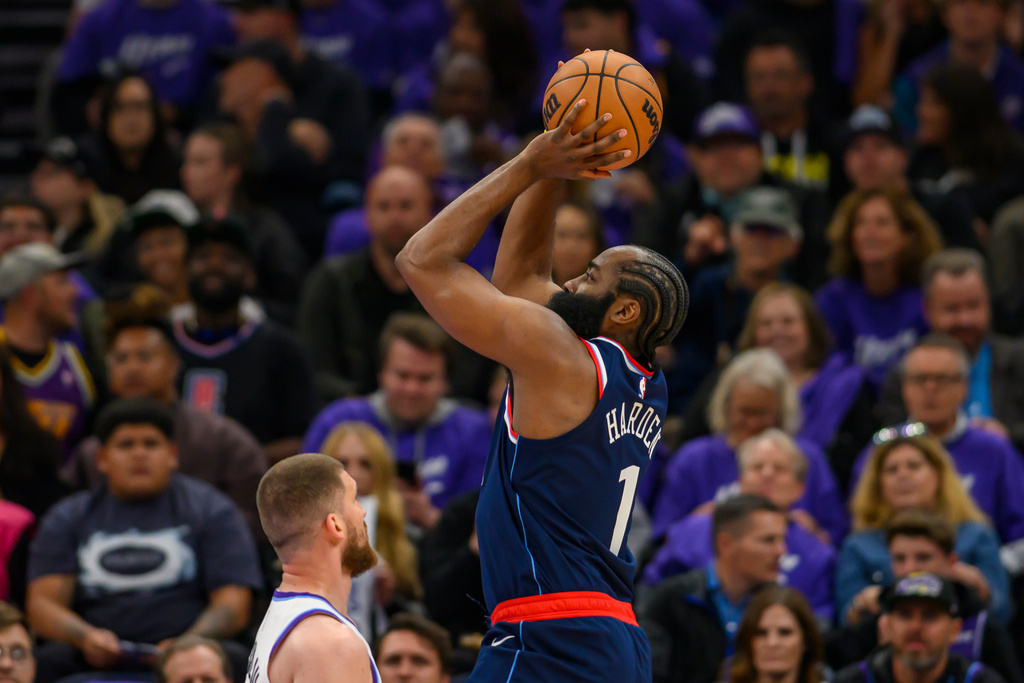 LA Clippers guard James Harden (1) takes the shot over Utah Jazz guard Svi Mykhailiuk (10) during the first half of an NBA basketball game, Wednesday, Oct. 22, 2025, in Salt Lake City. (AP Photo/Tyler Tate)