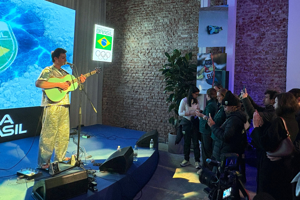 Brazilian snowboarder Pat Burgener plays a concert at the Brazil House, during the 2026 Winter Olympics, in Milan, Italy, Tuesday, Feb. 17, 2026. (AP Photo/Stefanie Dazio)