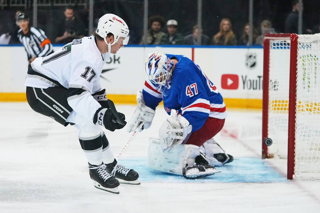 Los Angeles Kings' Taylor Ward (17) shoots the puck past New York Rangers goaltender James Reimer (47) during the first period of an NHL hockey game Monday, Oct. 26, 2026, in New York. (AP Photo/Frank Franklin II)