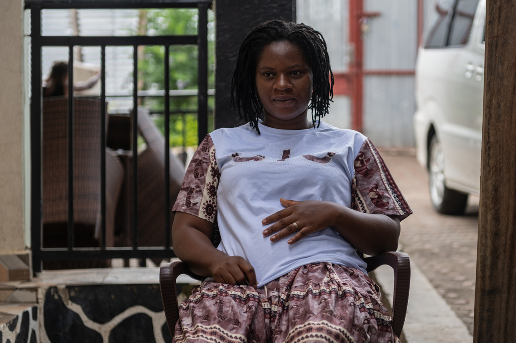Esther Lutula, a 26 year-old woman who is four months pregnant and a mother of four, sits outside her house in Bunia, northeastern, Congo, Tuesday, June 16, 2026. (AP Photo/Moses Sawasawa)