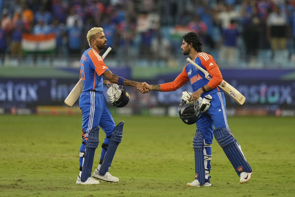India's Hardik Pandya and Tilak Varma shake hands after wining during the Asia Cup cricket match against Pakistan at Dubai International Cricket Stadium, United Arab Emirates, Sunday, Sept. 21, 2025. (AP Photo/Altaf Qadri)