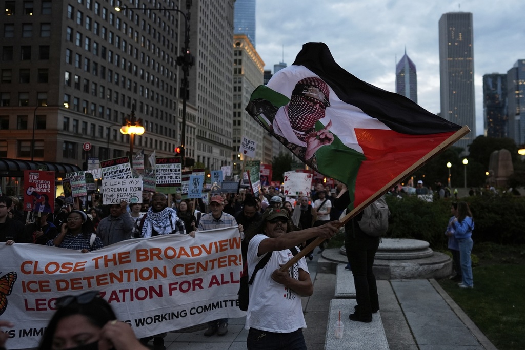 People march during Illinois Coalition for Immigrant & Refugee Rights' "Chicago Says No Trump No Troops" protest Saturday, Sept. 6, 2025, in Chicago. (AP Photo/Carolyn Kaster)