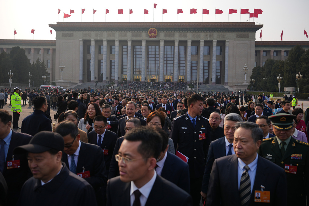 Delegates leave the Great Hall of the People after attending the closing session of the National People's Congress (NPC), in Beijing, China, Thursday, March 12, 2026. (AP Photo/Andy Wong)