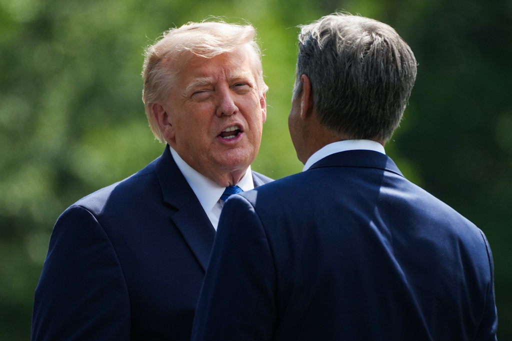 President Donald Trump, left, and CIA Director John Ratcliffe speak as they depart following a cabinet meeting at Camp David, near Thurmont, Md., Friday, July 31, 2026. (Nathan Howard/Pool Photo via AP)