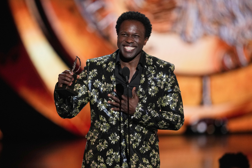 Joshua Henry accepts the award for best performance by an actor in a leading role in a musical for "Ragtime during the 79th Tony Awards on Sunday, June 7, 2026, at Radio City Music Hall in New York. (Photo by Charles Sykes/Invision/AP)
