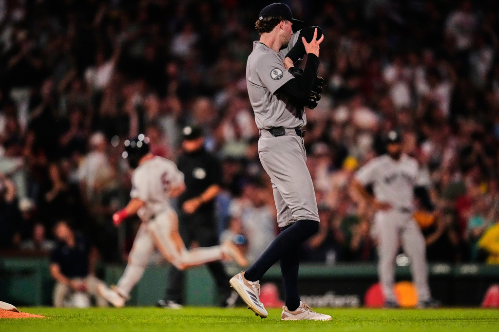 New York Yankees' Cam Schlittler walks off the mound as Boston Red Sox's Caleb Durbin rounds the bases on a two-run home run in the fifth inning of a baseball game, Thursday, June 25, 2026, in Boston. (AP Photo/Charles Krupa)