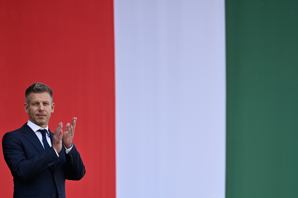 Hungarian Prime Minister Peter Magyar applauds in front of the Hungarian Parliament, after taking his oath of office in Budapest, Hungary, Saturday, May 9, 2026. (AP Photo/Denes Erdos)
