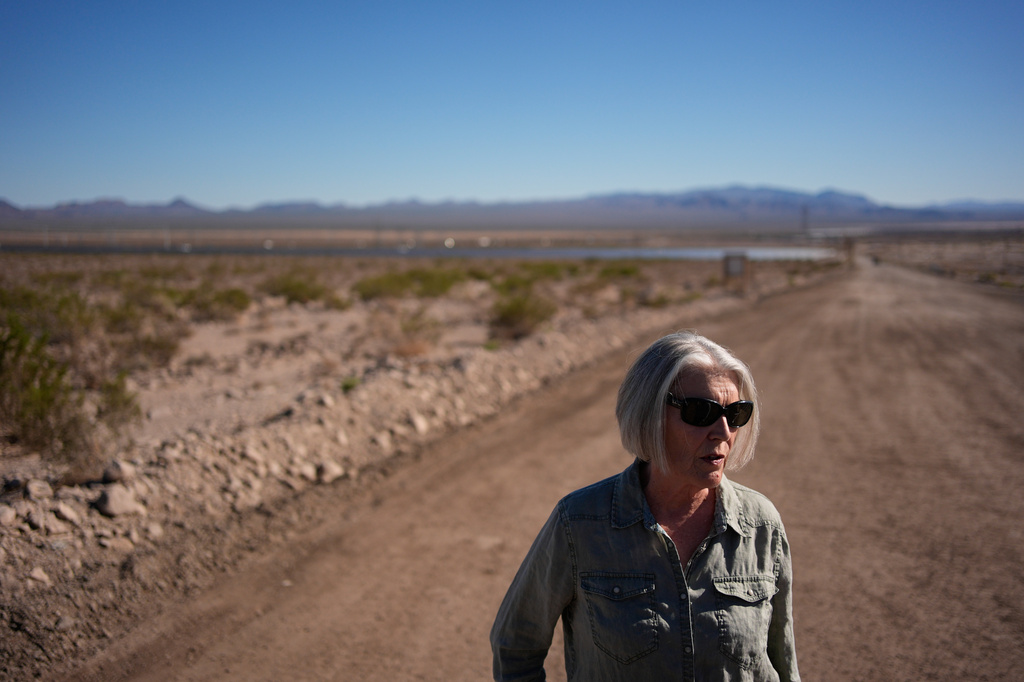 Janelle Sorenson stands beside land for a proposed data center Friday, Oct. 2, 2026, near Boulder City, Nev. (AP Photo/John Locher)
