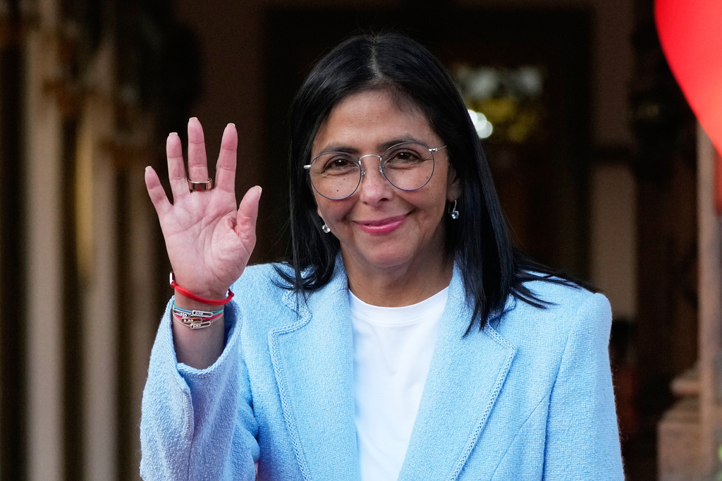 FILE - Venezuela's acting President Delcy Rodriguez waves after bidding farewell to U.S. Energy Secretary Chris Wright following their meeting at Miraflores Palace in Caracas, Venezuela, Feb. 11, 2026. (AP Photo/Ariana Cubillos, File)