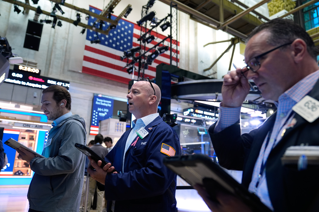 Traders work on the floor at the New York Stock Exchange in New York, Monday, July 6, 2026. (AP Photo/Seth Wenig)