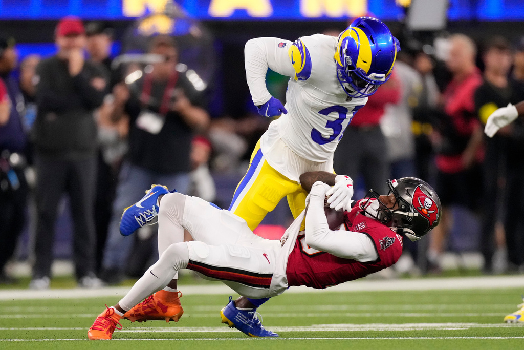 Los Angeles Rams cornerback Darious Williams (31) defends against Tampa Bay Buccaneers wide receiver Tez Johnson, bottom, during the first half of an NFL football game Sunday, Nov. 23, 2025, in Inglewood, Calif. (AP Photo/Mark J. Terrill)
