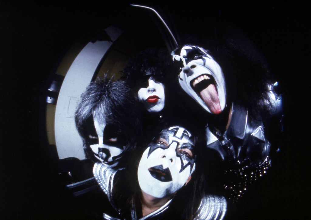 FILE - Members of the rock group KISS; Gene Simmons, clockwise from right, Ace Frehley, Peter Criss and Paul Stanley are photographed before a concert in Hartford, Conn.,on Feb. 16, 1977. (AP Photo/Richard Drew, File)