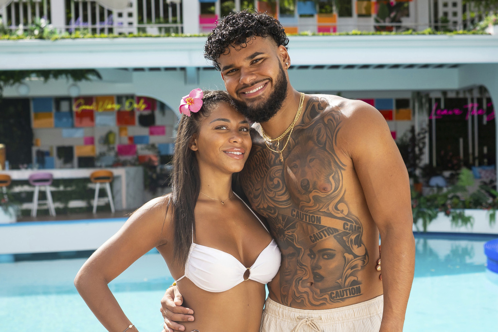 This image released by Peacock shows Amaya Espinal, left, and Bryan Arenales from the reality series "Love Island USA." (Photo by: Ben Symons/Peacock)