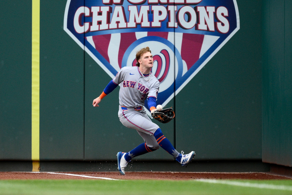 New York Mets right fielder Carson Benge tries to get to a ball popped up by Washington Nationals' Daylen Lile in foul territory during the first inning of a baseball game, Thursday, May 21, 2026, in Washington. (AP Photo/Nick Wass)