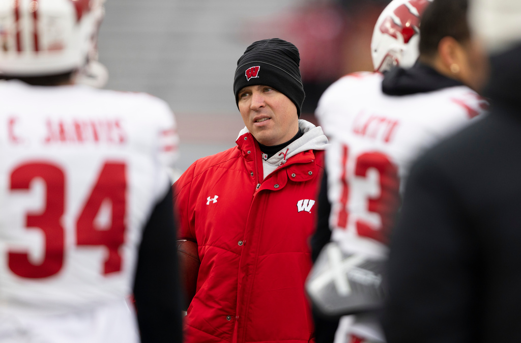 FILE - Wisconsin interim head coach Jim Leonhard leads warmups before playing against Nebraska in an NCAA college football game in Lincoln, Neb., Nov. 19, 2022. (AP Photo/Rebecca S. Gratz)