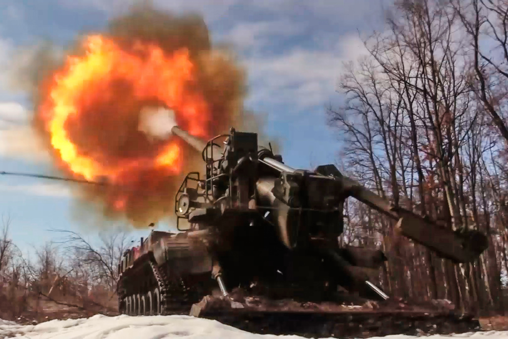 In this image made from video provided by Russian Defense Ministry Press Service on Monday, March 23, 2026, a Russian Pion self-propelled 203 mm cannon fires towards a Ukrainian position. (Russian Defense Ministry Press Service via AP)