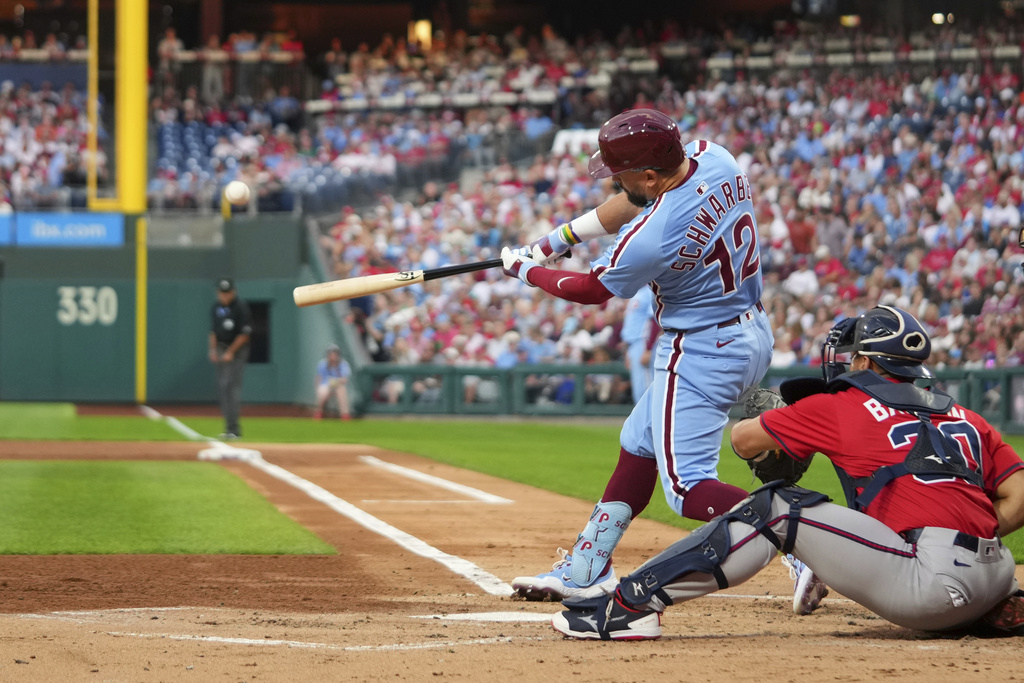 Philadelphia Phillies' Kyle Schwarber hits a home run against Atlanta Braves pitcher Cal Quantrill during the first inning of a baseball game Thursday, Aug. 28, 2025, in Philadelphia. (AP Photo/Matt Slocum)