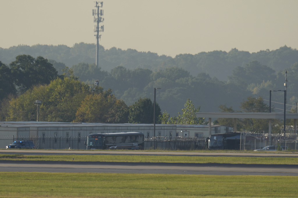 Buses carrying Korean workers detained arrives at Hartsfield-Jackson International Airport in Atlanta, Thursday, Sept. 11, 2025. (AP Photo/George Walker IV)