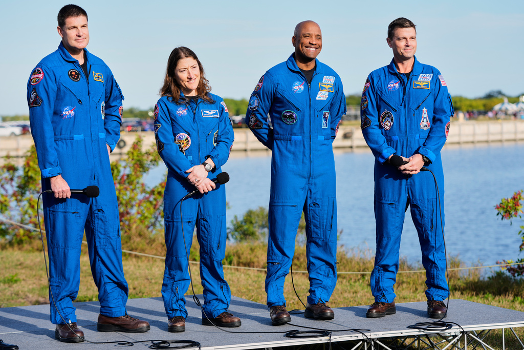 The crew of the new NASA moon rocket, Artemis II, take part in a news conference, from left, Canadian Space Agency astronaut Jeremy Hansen, mission specialist, Christina Koch, pilot Victor Glover and commander Reid Wiseman at the Kennedy Space Center, Saturday, Jan. 17, 2026, in Cape Canaveral, Fla. (AP Photo/John Raoux)