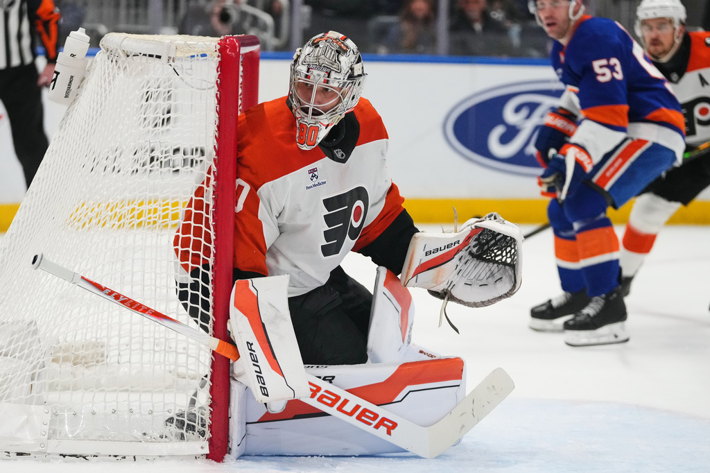 Philadelphia Flyers goaltender Dan Vladar (80) protects the net during the second period of an NHL hockey game against the New York Islanders Friday, April 3, 2026, in Elmont, N.Y. (AP Photo/Frank Franklin II)