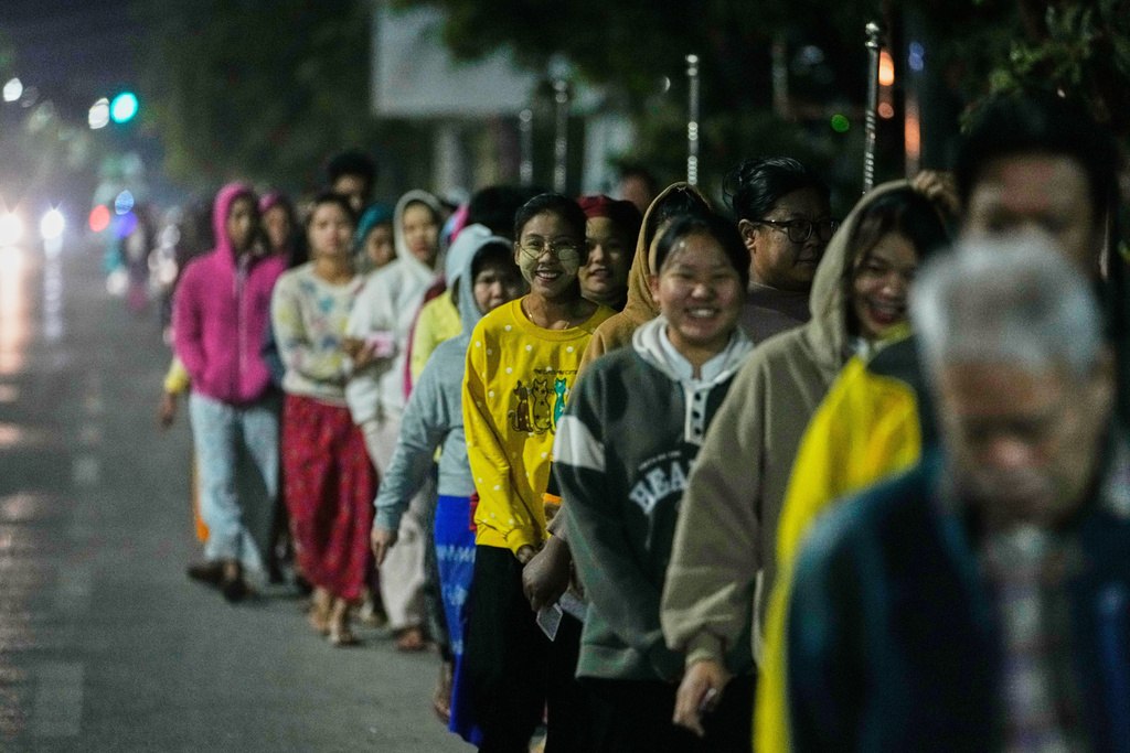 Voters wait for a polling station to open during the second phase of general election in Mandalay, central Myanmar, Sunday, Jan. 11, 2026. (AP Photo/Aung Shine Oo)