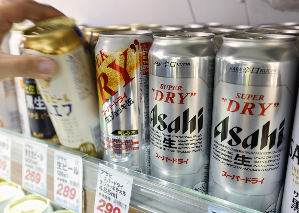 Cans of beer sit on a shelf at a supermarket in Yokohama, near Tokyo Friday, Oct. 3, 2025. (Daiki Katagiri/Kyodo News via AP)