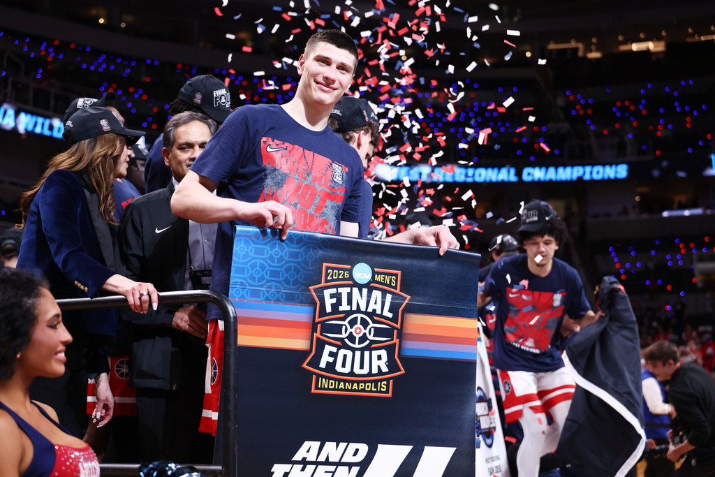 Arizona forward Ivan Kharchenkov smiles on the stage after a win over Purdue in the Elite Eight of the NCAA college basketball tournament, Saturday, March 28, 2026, in San Jose, Calif. (AP Photo/Kelley L Cox)