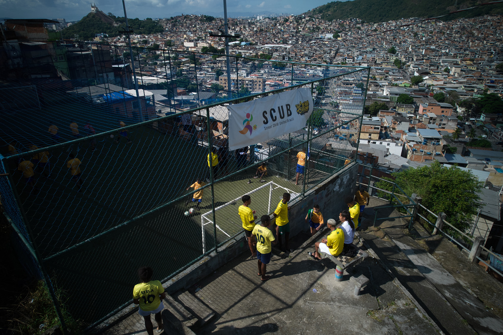 Youths attend soccer training organized by the Street Child United Brazil social project in the Complexo da Penha of Rio de Janeiro, Wednesday, June 3, 2026. (AP Photo/Silvia Izquierdo)