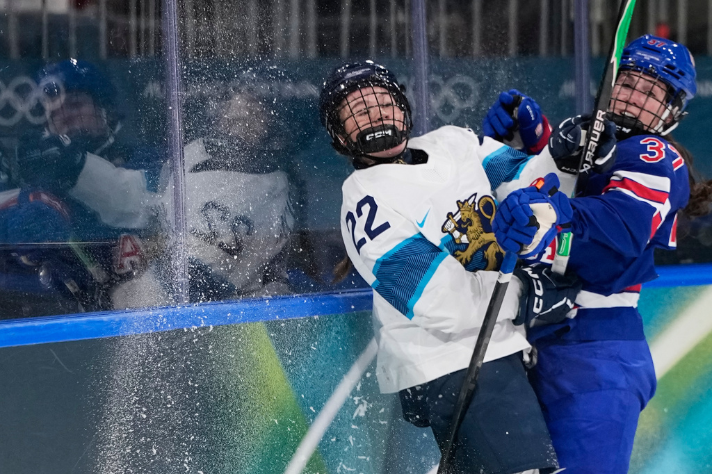 United States' Abbey Murphy, right, checks Finland's Julia Schalin during a preliminary round match of women's ice hockey between the United States and Finland at the 2026 Winter Olympics, in Milan, Italy, Saturday, Feb. 7, 2026. (AP Photo/Petr David Josek)