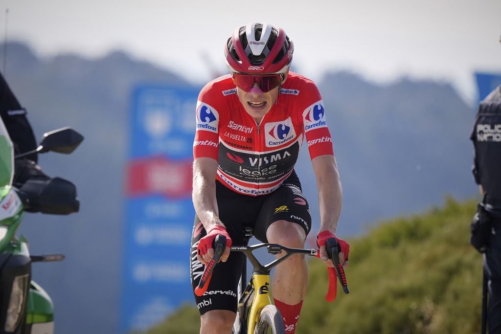 Danish cyclist Jonas Vingegaard completes the final meters before winning the 20th stage and his first overall victory in the Spanish cycling race La Vuelta, from Robledo de Chavela to Bola del Mundo, in Puerto de Navacerrada, Spain, on Saturday, September 13, 2025. (AP Photo/Manu Fernández)