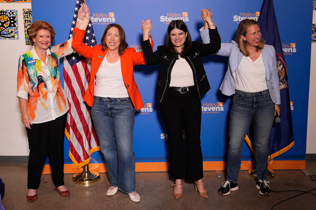 Rep. Haley Stevens, D-Mich., second from right, a candidate in the Democratic primary for U.S. Senate in Michigan, appears with former Sen. Debbie Stabenow, D-Mich., from left, President of EMILY's List Jessica Mackler and Rep. Hillary Scholten, D-Mich., during a campaign event, Monday, Aug. 3, 2026, in Grand Rapids, Mich. (AP Photo/Paul Sancya)