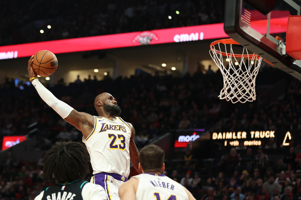 Los Angeles Lakers forward LeBron James (23) dunks against the Portland Trail Blazers during the first half of an NBA basketball game Saturday, Jan. 17, 2026, in Portland, Ore. (AP Photo/Amanda Loman)