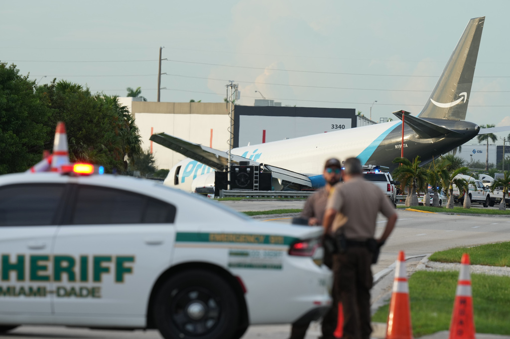 An Amazon cargo plane sits at the Miami International Airport (MIA) after it overshot the runway, Sunday, Sept. 6, 2026. (AP Photo/Lynne Sladky)