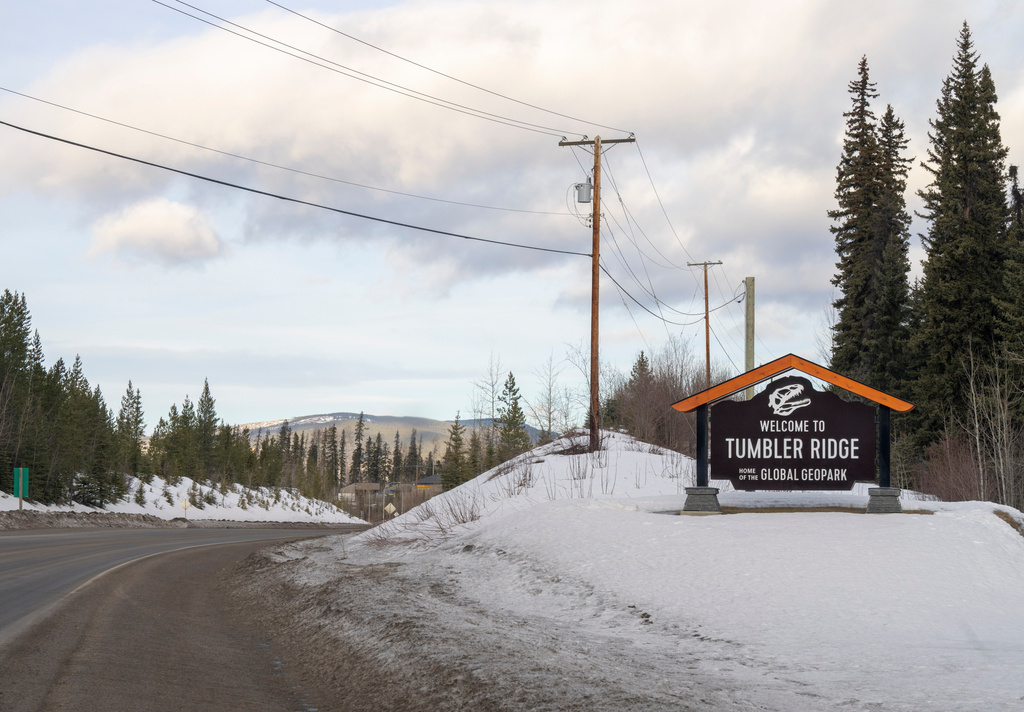 A welcome sign is seen entering the town of Tumbler Ridge, British Columbia, Canada, on Thursday, Feb. 12, 2026. (Christinne Muschi/The Canadian Press via AP)