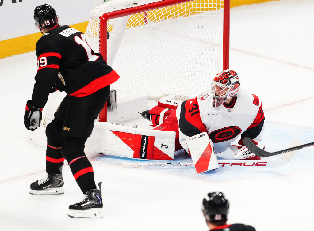 Ottawa Senators' Drake Batherson (19) scores on Carolina Hurricanes goaltender Frederik Andersen (31) during the second period of an NHL hockey playoff game in Ottawa, Ontario, Thursday, April 23, 2026. (Sean Kilpatrick/The Canadian Press via AP)