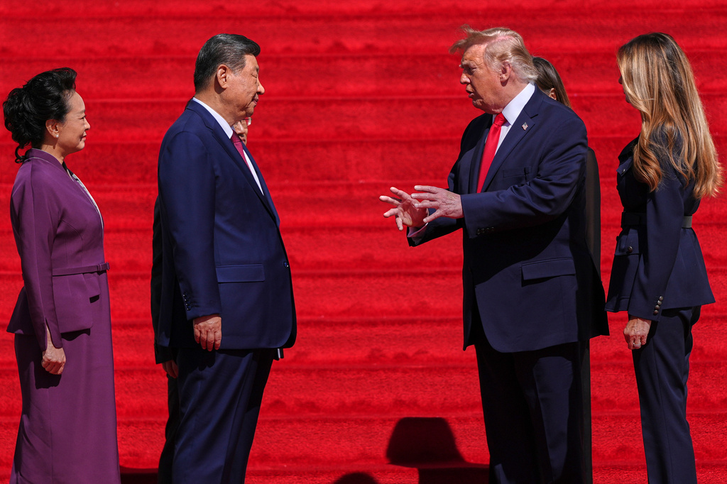 President Donald Trump, center right, and first lady Melania Trump, right, speak with China's President Xi Jinping, center left, and his wife Peng Liyuan on the steps of the National Archives Museum, Friday, Sept. 25, 2026, in Washington. (AP Photo/Julia Demaree Nikhinson)