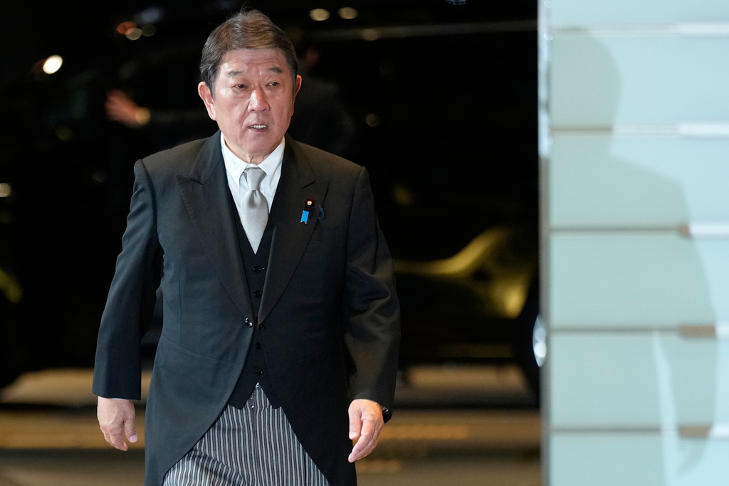 Toshimitsu Motegi, newly appointed foreign minister, arrives at the prime minister's office in Tokyo, Japan, Tuesday, Oct. 21, 2025.(AP Photo/Eugene Hoshiko)