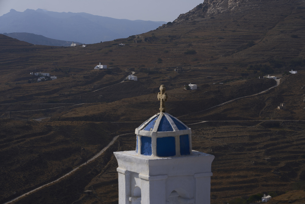 Family-owned chapels stand on the Aegean Sea island of Tinos, Greece, Sunday, Sept. 7, 2025. (AP Photo/Petros Giannakouris)