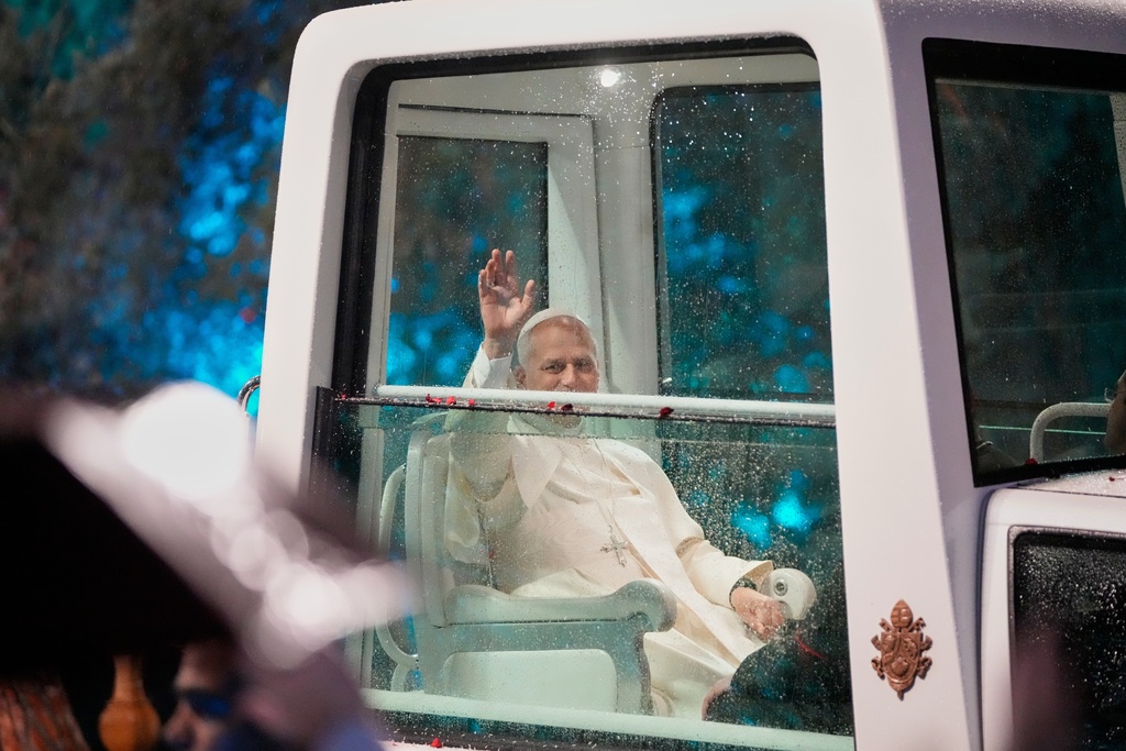 Pope Leo XIV waves as he arrives for a welcoming ceremony at the presidential palace in Baabda, east of Beirut, Lebanon, Sunday, Nov. 30, 2025.(AP Photo/Hassan Ammar)