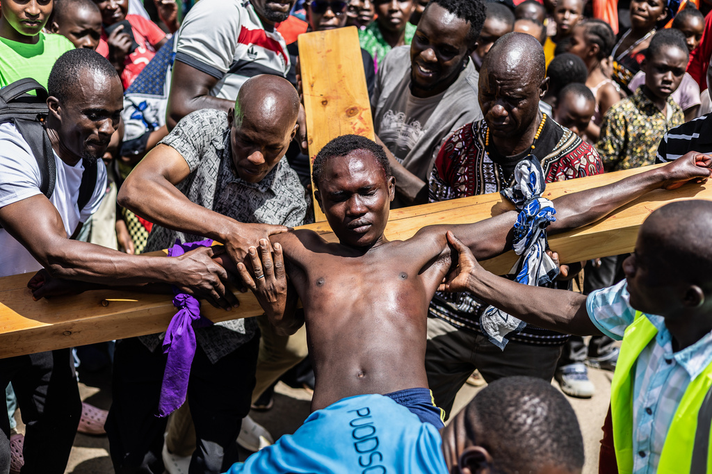 Christians take part in a Way of the Cross re-enactment of the crucifixion of Jesus Christ on Good Friday during Holy Week in Kibera informal settlement in Nairobi, Kenya, Friday, April 3, 2026. (AP Photo/Samson Otieno)