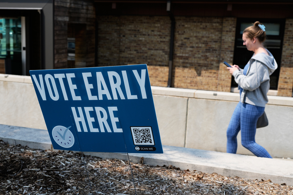 A voter arrives to a polling place in Milwaukee, Tuesday, July 28, 2026. (AP Photo/Nam Y. Huh)
