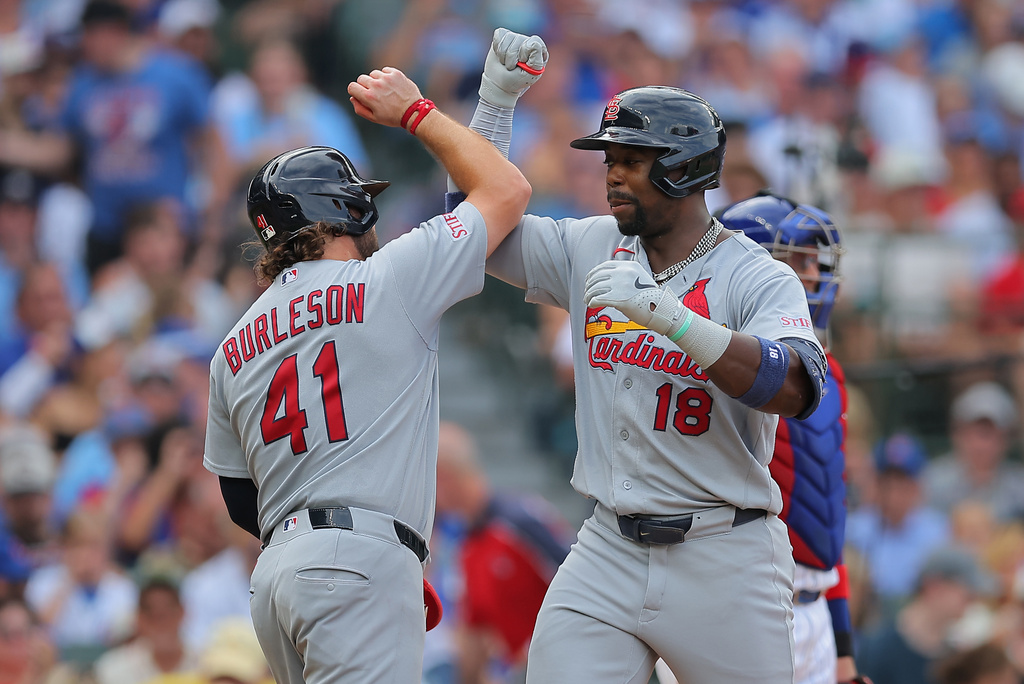 St. Louis Cardinals' Jordan Walker (18) celebrates with teammate Alec Burleson (41) after hitting a two-run home run during the fourth inning of a baseball game against the Chicago Cubs, Sunday, Aug. 16, 2026, in Chicago. (AP Photo/Melissa Tamez)