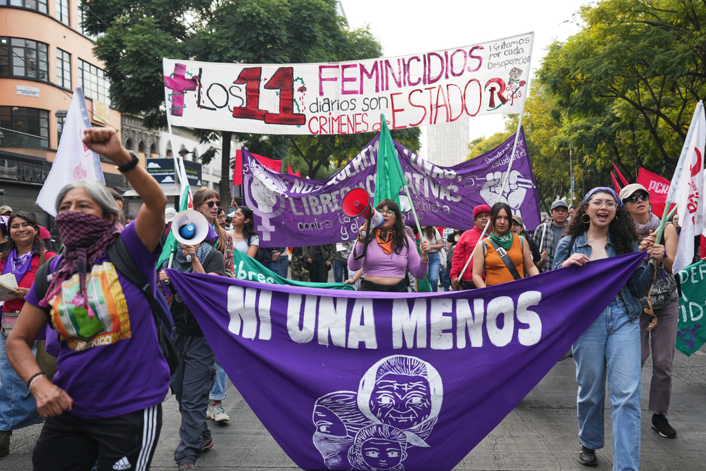 Demonstrators attend a protest marking International Day for the Elimination of Violence Against Women in Mexico City, Tuesday, Nov. 25, 2025. (AP Photo/Claudia Rosel)