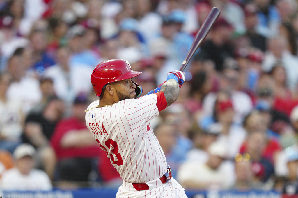 Philadelphia Phillies' Edmundo Sosa watches his three-run home run off Washington Nationals pitcher Mitchell Parker during the fourth inning of a baseball game, Saturday, Aug. 23, 2025, in Philadelphia. (AP Photo/Derik Hamilton)