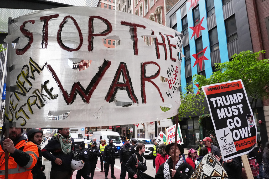 People march during a May Day rally in Chicago, Friday, May 1, 2026. (AP Photo/Nam Y. Huh)