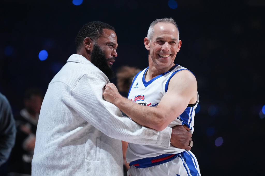Coach Anthony Anderson, left, jokes around with Rick Schnall during an NBA basketball's All-Star Celebrity Game Friday, Feb. 13, 2026, in Inglewood, Calif. (AP Photo/Jae C. Hong)