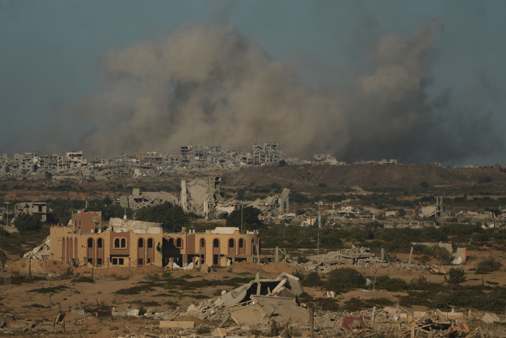 Smoke rises following an Israeli military strike in Gaza City, as seen from the central Gaza Strip, Wednesday, Oct, 1, 2025. (AP Photo/Jehad Alshrafi)