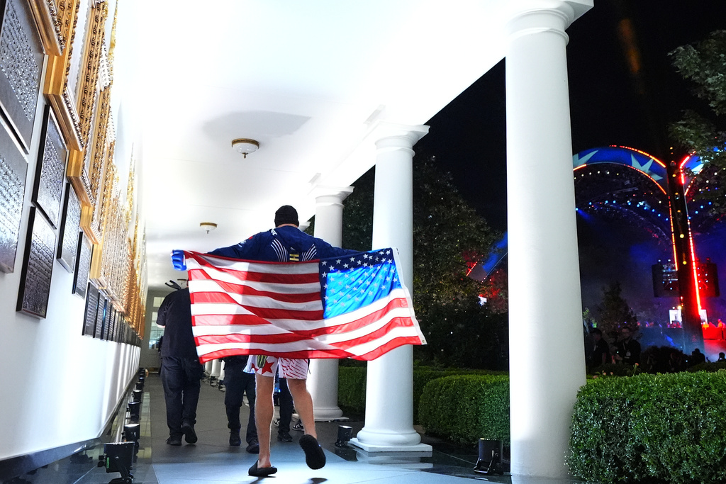 Lightweight Justin Gaethje is filmed by a crew on the White House Collannade, as he walks to UFC Freedom 250 on the South Lawn of the White House, Monday, June 15, 2026, in Washington. (AP Photo/Julia Demaree Nikhinson)